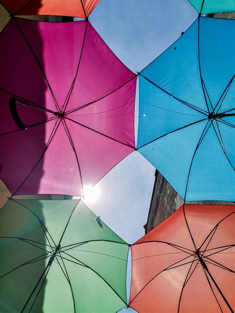 Colorful Umbrellas Against Blue Sky · Free Stock Photo