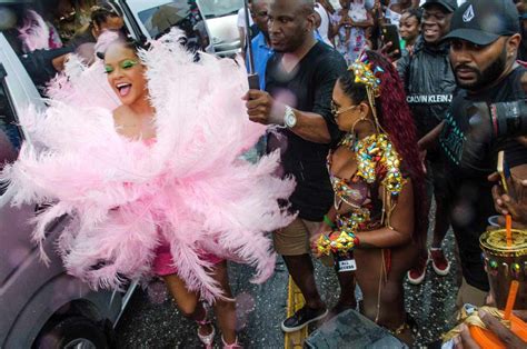 Rihanna Wears Giant Pink Feather Ensemble To Crop Over Carnival