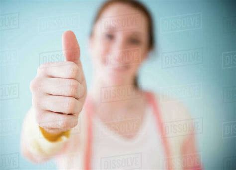 Teenage Girl Showing Thumb Up Studio Shot Stock Photo Dissolve