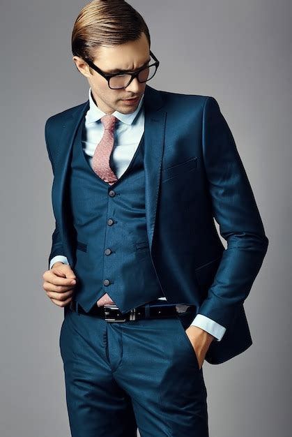 Free Photo Young Elegant Handsome Businessman Male Model In A Suit And Fashionable Glasses