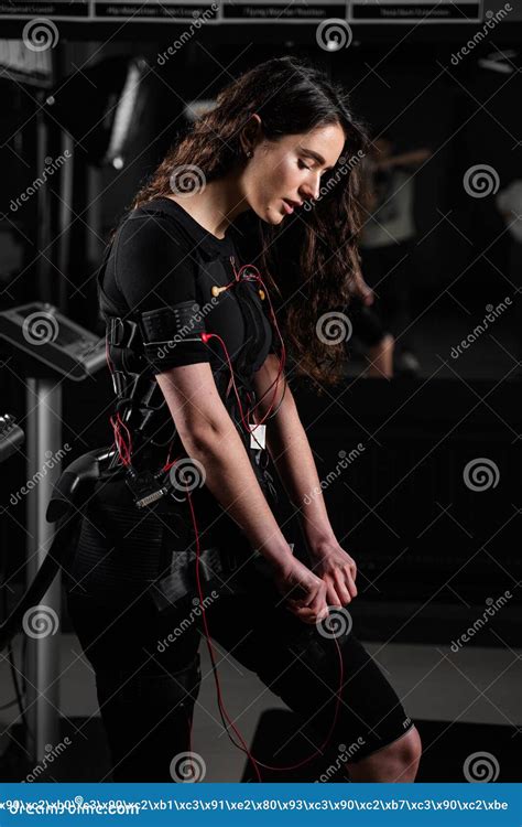 Girl In Ems Suit In Gym Sport Training In Electrical Muscle