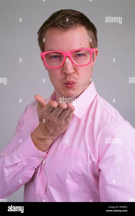 Face Of Young Feminine Businessman With Eyeglasses Blowing Kiss Stock