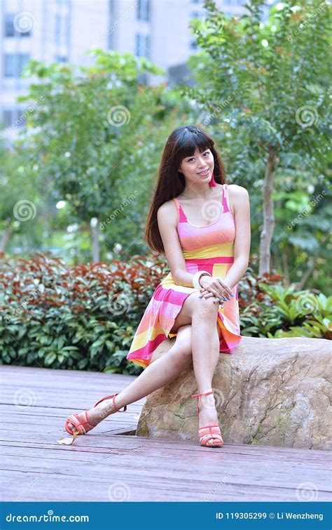 Beautiful And Sex Asian Girl Shows Her Youth In The Park Stock Image