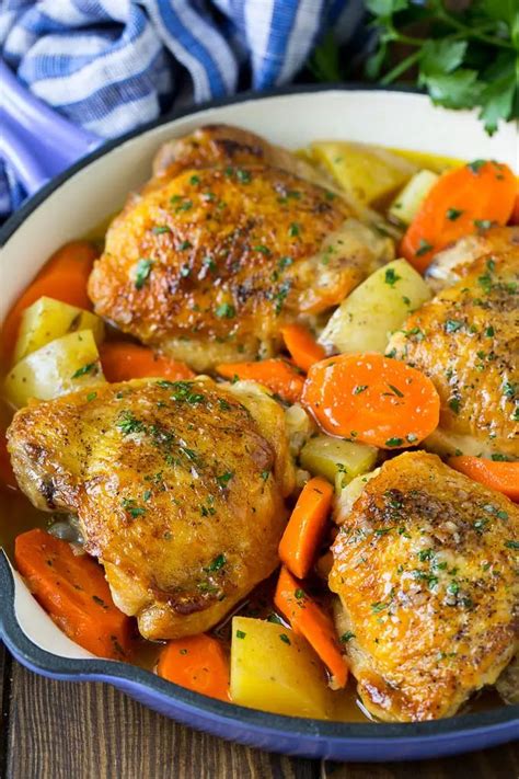 braised chicken thighs with carrots and potatoes in a skillet chicken thigh recipes crockpot