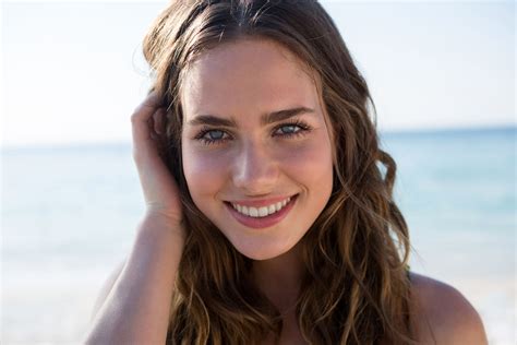Portrait Of Smiling Beautiful Woman At Beach Photo From Pikwizard