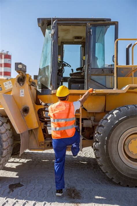 Experienced Construction Worker Using Truck At Factory Stock Image