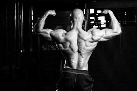 Bodybuilder Flexing Muscles Stock Photo Image Of Equipment Hairless