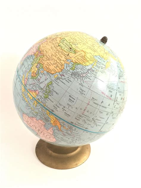 A Wonderful Small Spinning Globe On A Brass Stand 9 Across 11 Tall