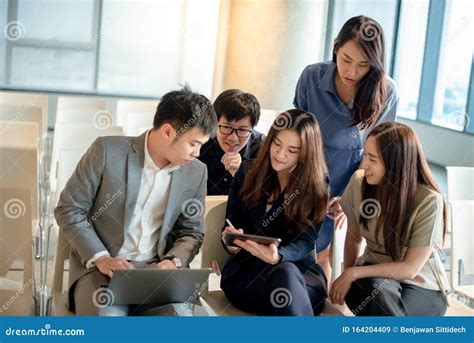 Asian Colleagues Discussing In Conference Room Stock Image Image Of