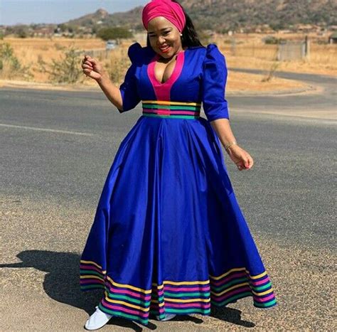 Winnie Mashaba In Blue Patterned Sepedi Flared Dress With Pink Headwrap