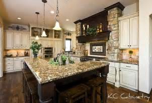 This look comes from—you guessed it—tuscany, italy, so it's all about the detailing, mediterranean culture, and gently aged look of the furniture, walls, and flooring. Tuscan kitchen design - light distressed cabinets, dark ...