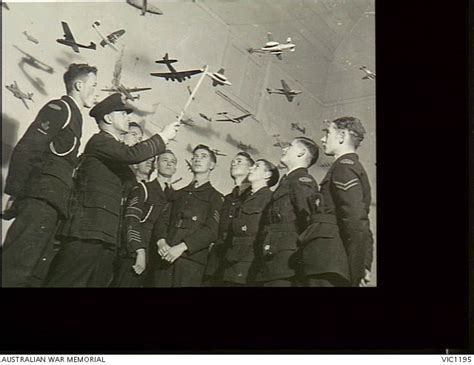 A Group Of Air Training Corps Members Being Given Instruction In