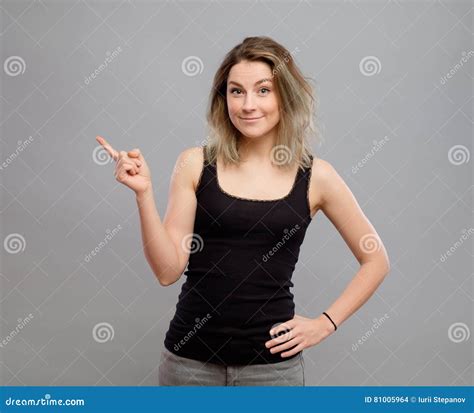 Beautiful Young Woman Pointing To Somewhere Stock Photo Image Of