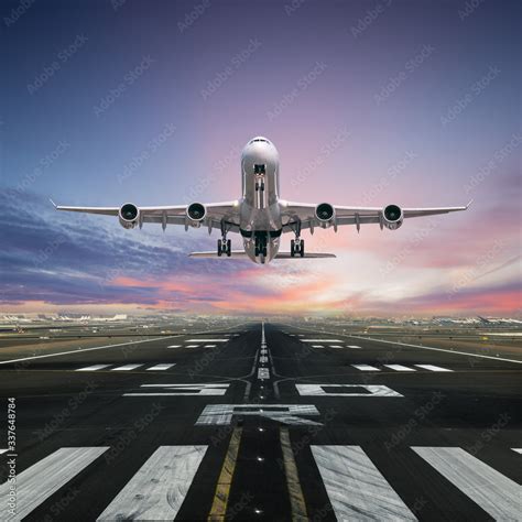 Airplane Taking Off From The Airport Runway Front View Stock Photo