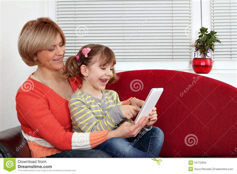 Mother And Daughter Play With Tablet Pc Stock Images