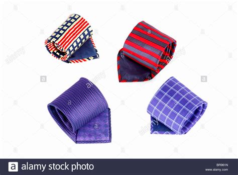 Four Coloured Patterned And Striped Silk Ties Rolled Up Stock Photo Alamy