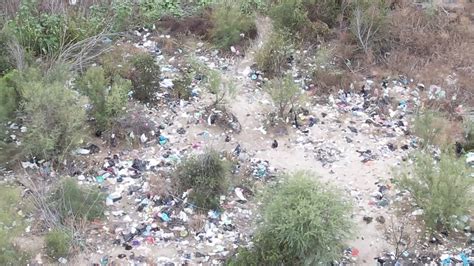 texas drone footage shows heaps of discarded trash and clothing at southern border crossing