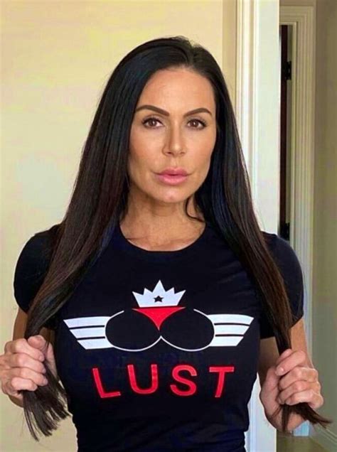 A Woman With Long Hair Wearing A T Shirt That Says Lust