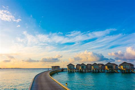 Beautiful Sunrise With Water Villas In Tropical Maldives Islan Stock