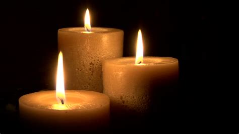 This Is A Seamless Loop Of 3 Warm Candles Gently Burning In A Black