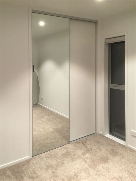The task designing fitted wardrobes with mirror sliding doors in an awkward shaped space. Mirror Sliding Doors - The Slide shop