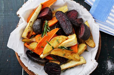 Place carrots in a single layer onto the prepared baking sheet. Baked Carrots And Beets With Herbs Stock Photo - Download ...