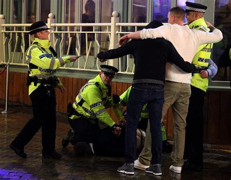 another sad drunk headed for cells or hard pressed aande so why are police posing for pictures