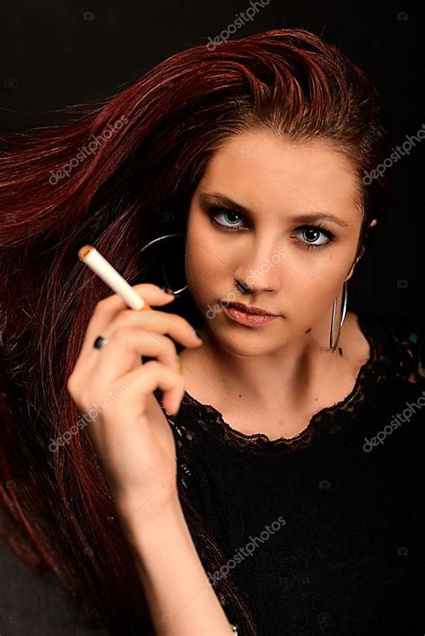 Woman Smoking A Cigarette — Stock Photo © Muro 69962079