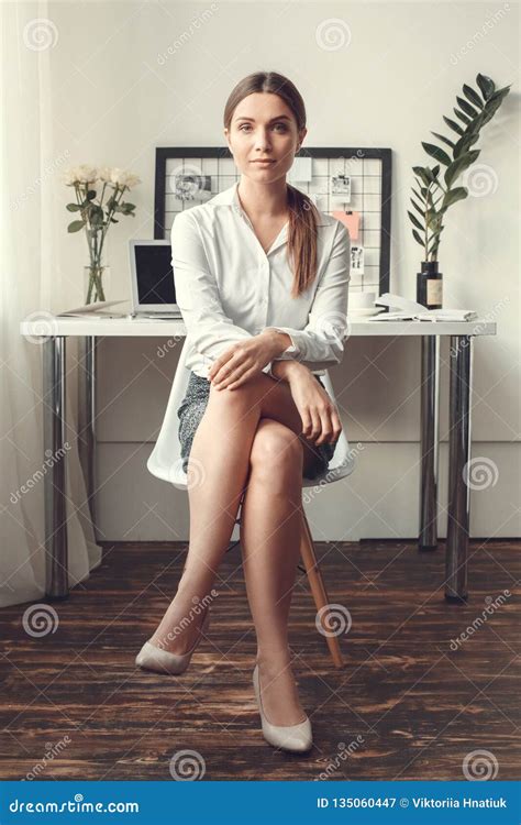 Young Woman Freelancer Indoors Home Office Concept Formal Style Sitting On Chair Stock Image