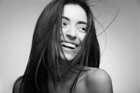 premium photo portrait of attractive caucasian smiling woman with long hair on grey background