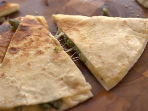 Add the onions and mushrooms and cook until the mushroom water is evaporated and they begin to brown, 5 to 7 minutes. The Cheesiest Quesadillas | Recipe | Food network recipes ...