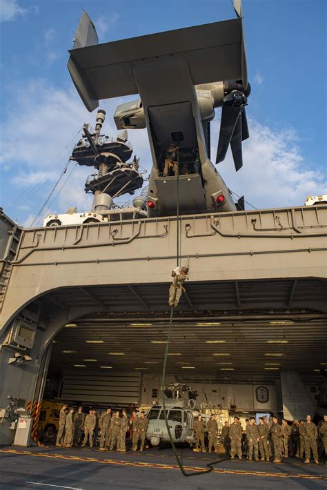Marines Practice Fast Roping On The Aircraft Elevator Of The Uss