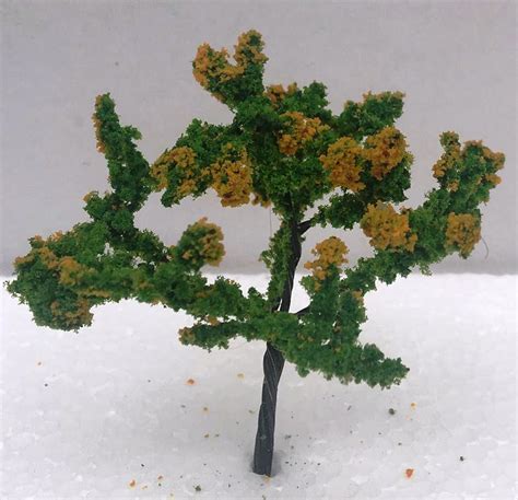 These beautiful flowers are the official state flower of hawaii. 8cm Tree Green with Yellow Flowers