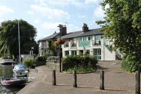 Ely riverside with the Boat House restaurant to the right. | House