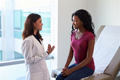 Female Doctor Meeting With Patient In Exam Room Nursing Degree Programs