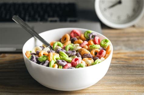 Colored Breakfast Cereals In A Bowl And Laptop Healthy Breakfast Close