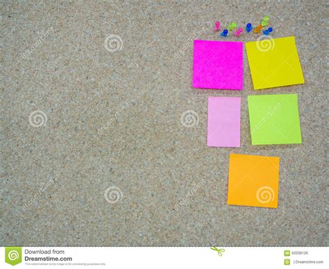 Group Of Thumbtacks Pinned And Paper Note On Cork Board Stock Photo