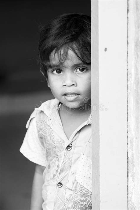 Portrait Of Unidentified Indian Poor Kid Boy Is Smiling Outddor In The