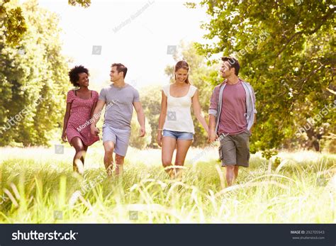 Four Friends Walking Together Countryside Stock Photo 292705943