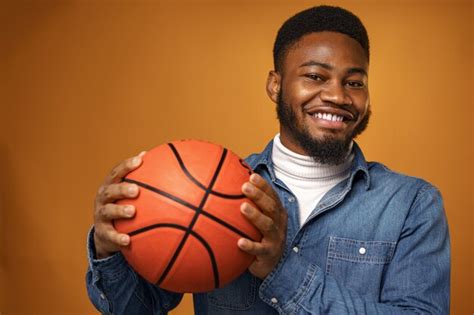 Premium Photo African American Man Holding Basketball Ball