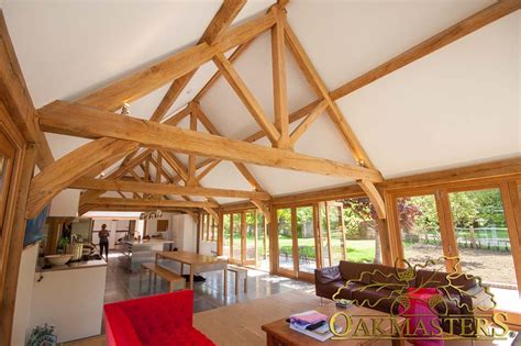 Vaulted ceiling trusses idea, ceiling is wooden color. King post trusses and open vaulted ceilings - Oakmasters