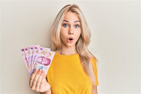 Beautiful Caucasian Blonde Girl Holding 50 Mexican Pesos Banknotes