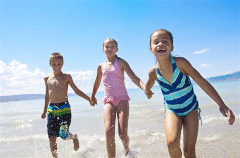 Kids Playing At The Beach Stock Photo Image Of Beauty 25972818