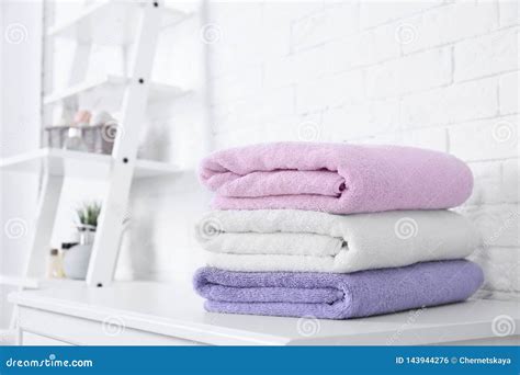 Stack Of Fresh Towels On Table In Bathroom Stock Photo Image Of