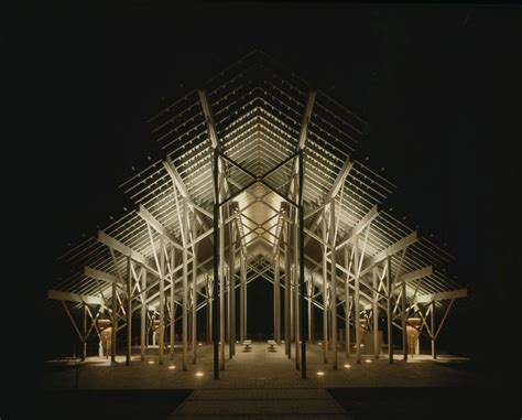 A Black And White Photo Of The Inside Of A Building At Night With Lights On