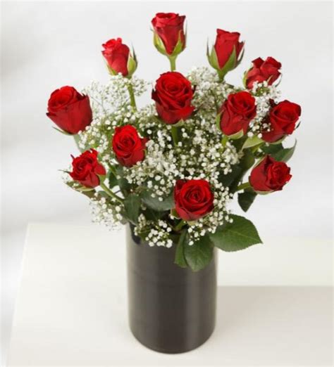 Red Roses Bouquet With Small White Flowers In Chic Black Vase