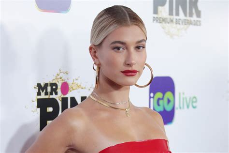 hailey baldwin wore a plastic y red mini dress with bright red pumps footwear news