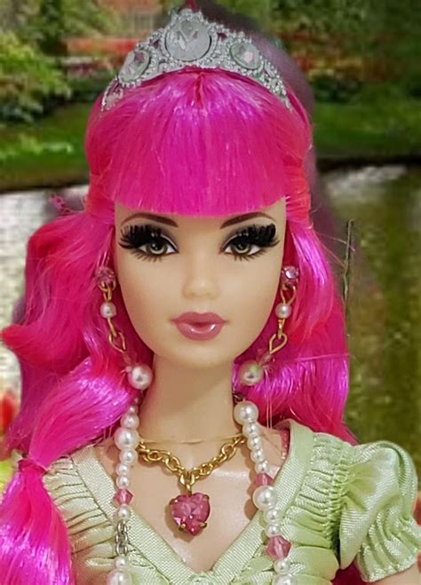 A Barbie Doll With Pink Hair Wearing A Tiara And Pearls On Its Head
