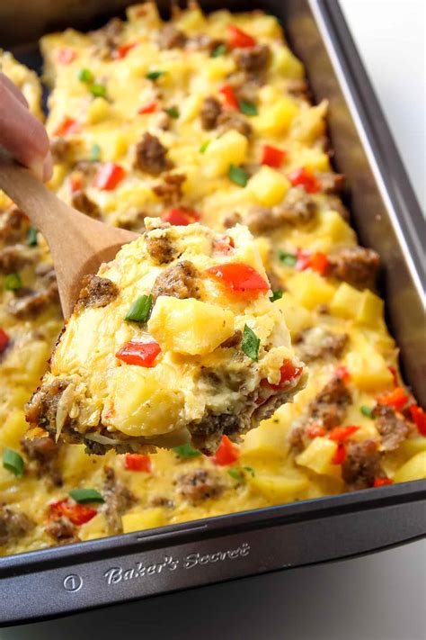 This cheesy side dish is easy to make and everyone loves it. Breakfast Casserole with Eggs, Potatoes and Sausage - LeelaLicious
