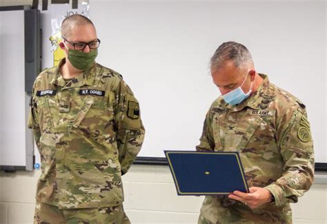 27th Infantry Division Commander Presents Certificate Of Appreciate To
